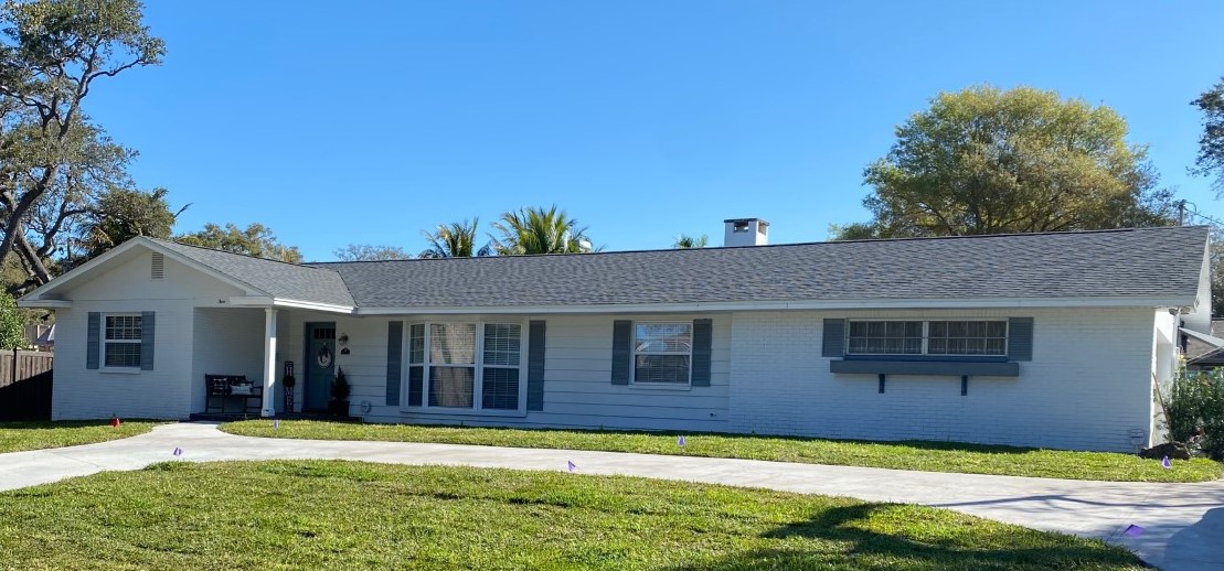 Single-story white ranch house with driveway