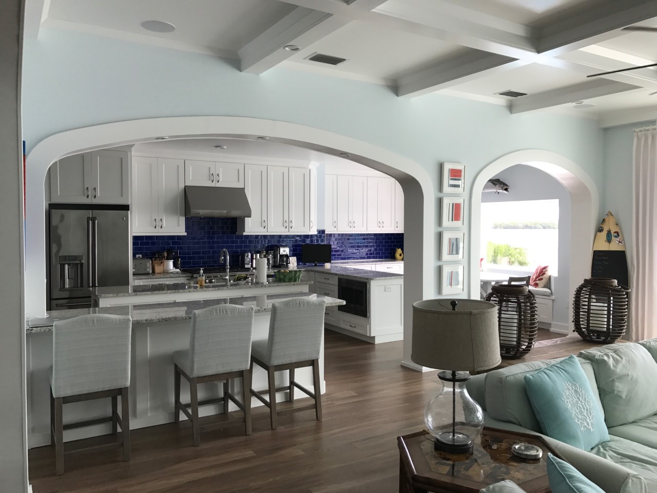 Open-concept coastal kitchen and living room