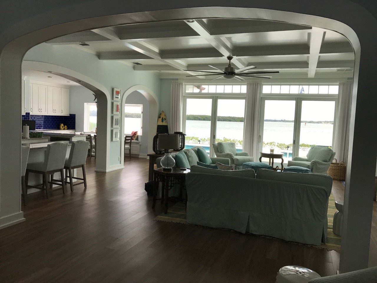 Open coastal living room with water view