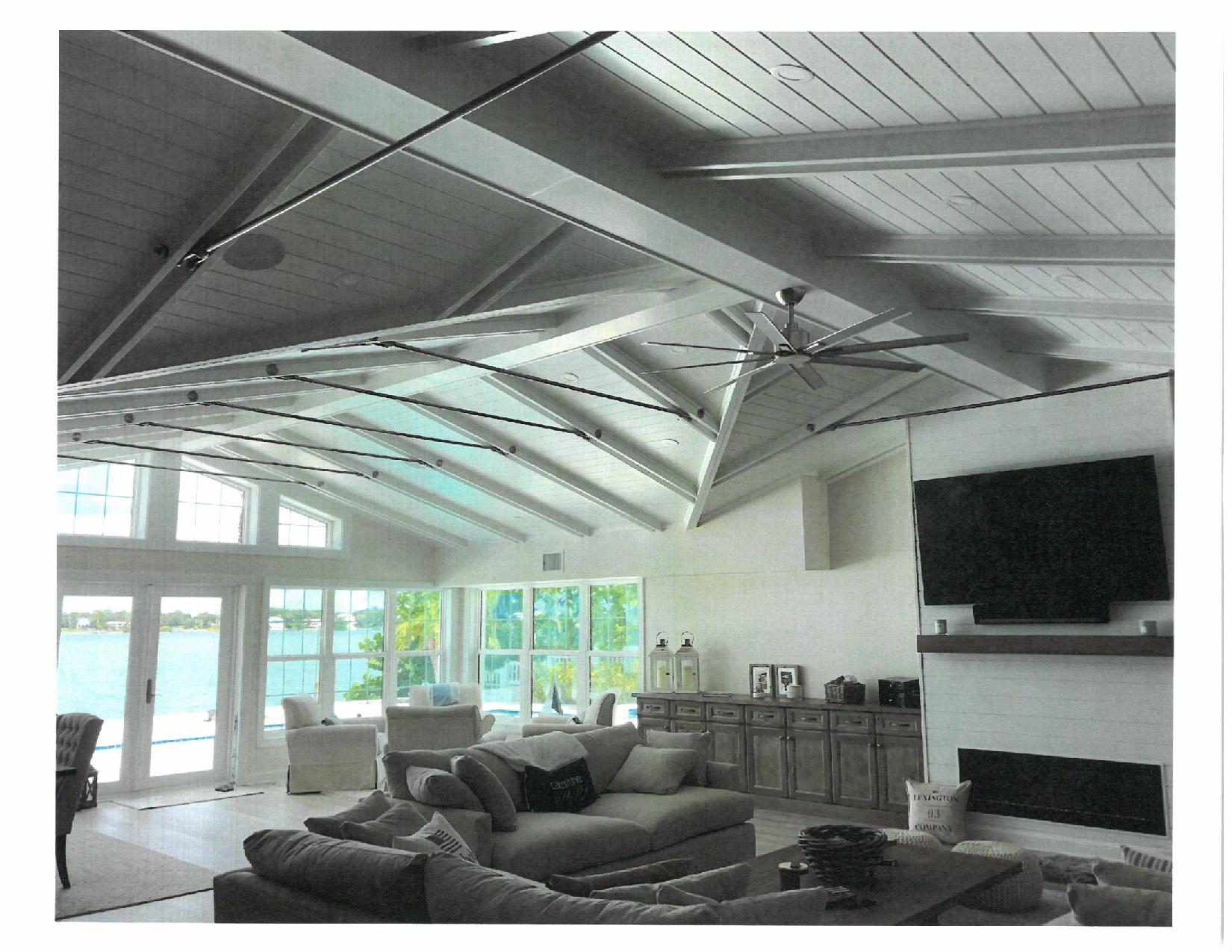 Bright living room with vaulted beams and fans