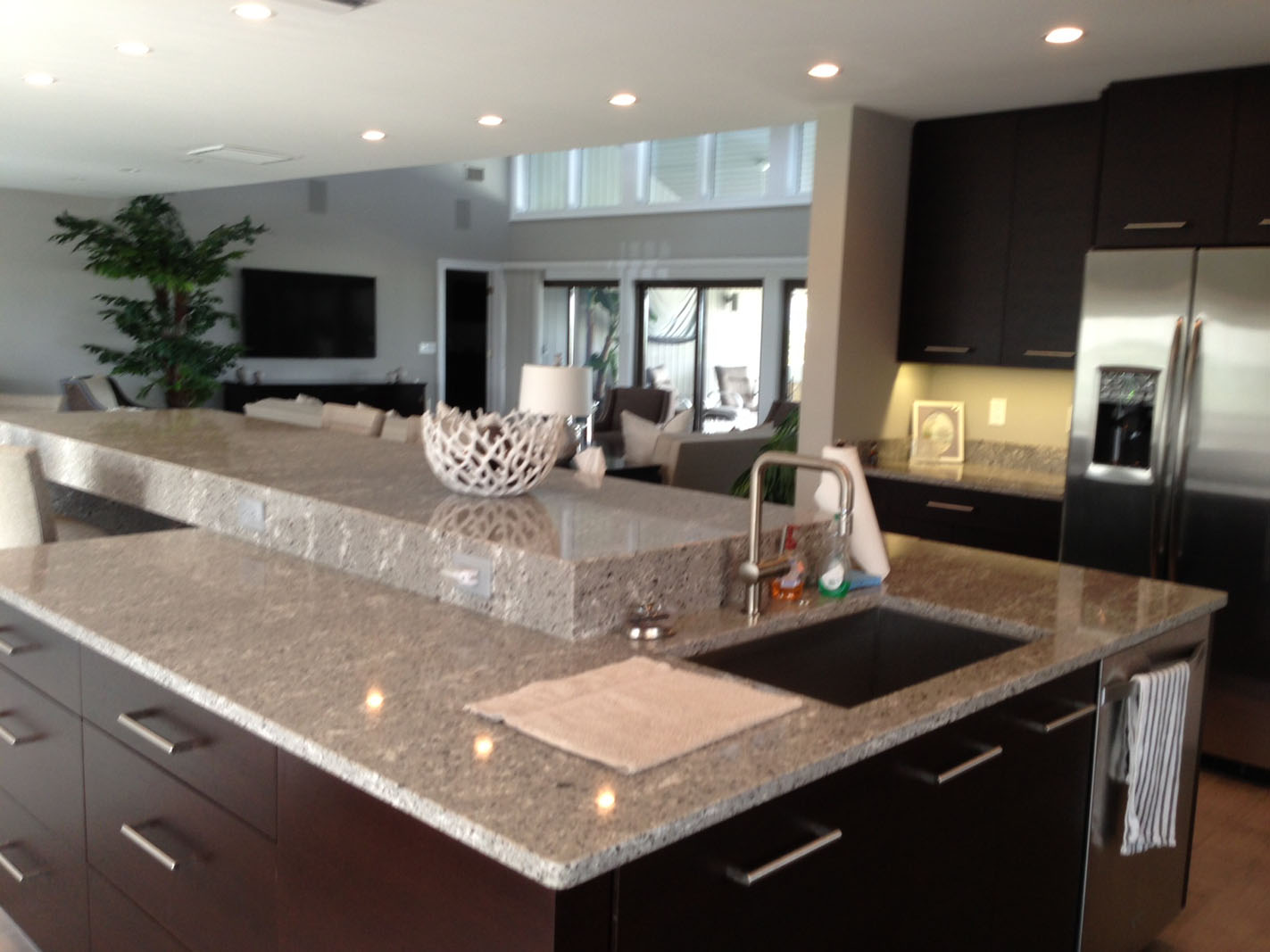 Modern kitchen with granite island and sink
