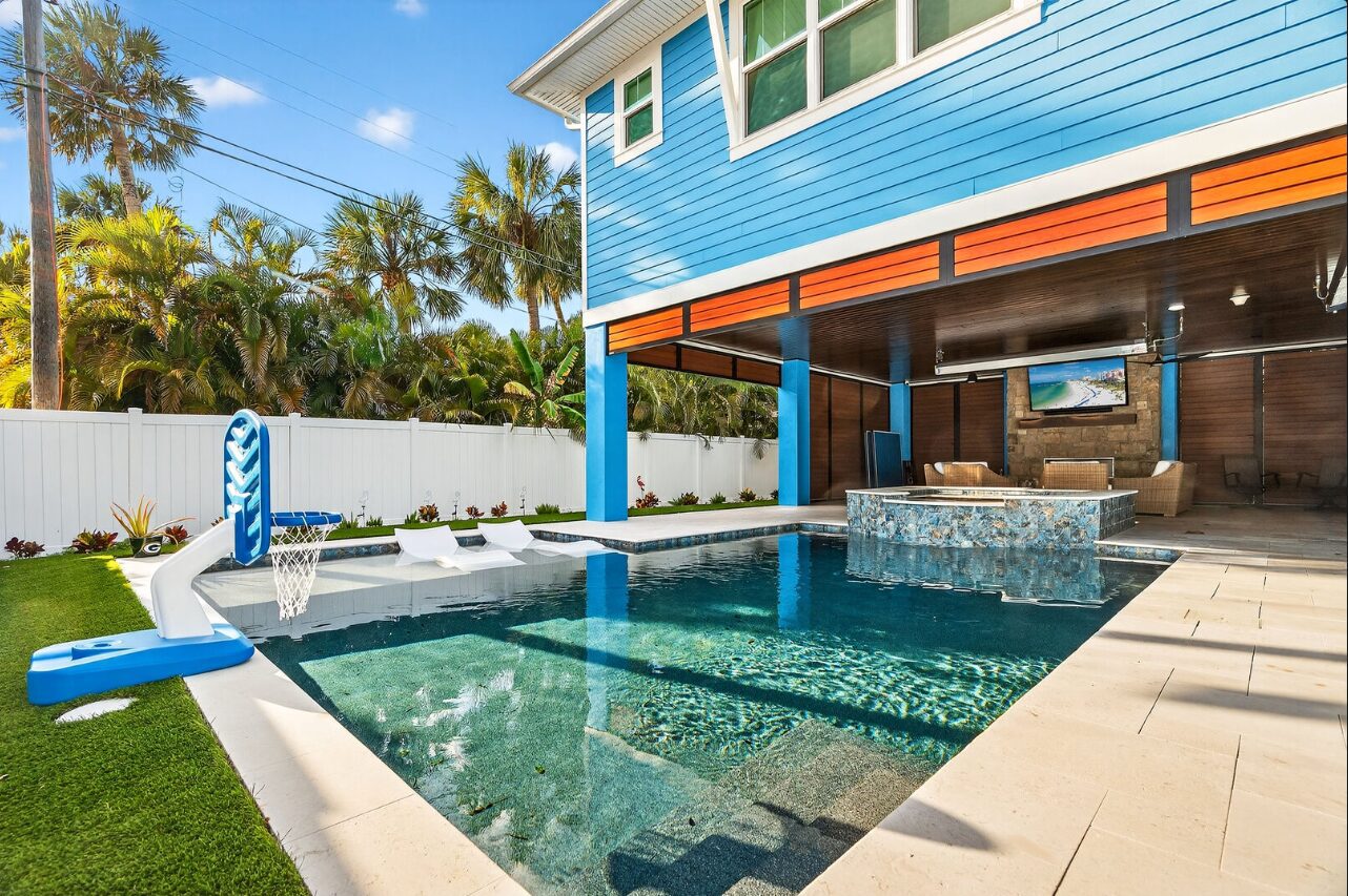 Tropical backyard pool with swim-up bar